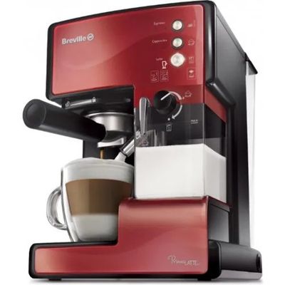 un gros plan sur une machine à café rouge avec une tasse de café