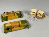two miniature houses that are sitting on a table