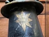 a clock on the top of a bell with a star on it