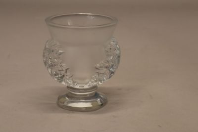 a clear glass cup sitting on top of a table