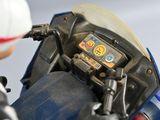 a close up of a toy motorcycle with a helmet on