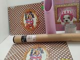 a roll of wrapping paper with a picture of a dog on it