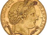 a gold coin with a woman ' s head on it