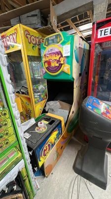 many arcade machines in a room with a lot of boxes