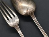 a fork and a spoon sitting on a table