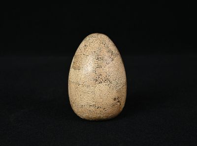 an image of a stone egg on a black background