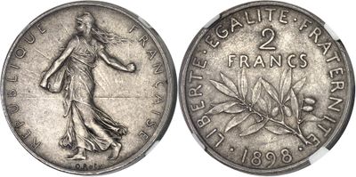 a close up of a coin with a woman on it