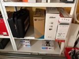 a shelf with many different types of electronics on it