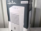 a box that has a small air conditioner inside of it