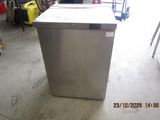 an image of a stainless steel dishwasher in a garage