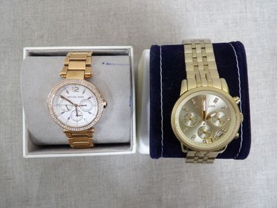 michael korsch watch and bracelet in a box on a table