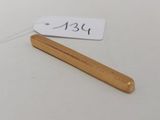 a small wooden stick with a price tag on it