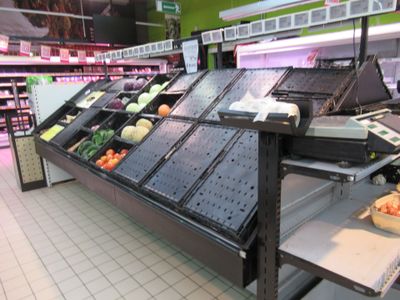 a produce section in a grocery store with fresh produce