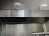 a picture of a stainless steel elevator with two lights