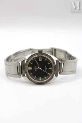 a close up of a watch on a white surface with a white background