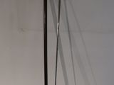 a picture of a pair of golf clubs leaning against a wall