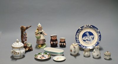 many different types of porcelain items displayed on the table