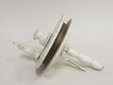 a spool of thread on a spool on a white surface