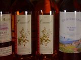 several bottles of wine are lined up on a table
