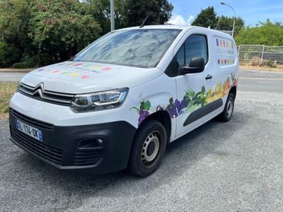 a white van that is parked on the side of the road