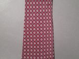 the tie is red and white with a pattern on it