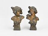 pair of bronze busts of a man and a woman