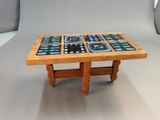 a wooden table with a clock on top of it