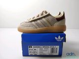 the adidas superstar is on top of a blue box