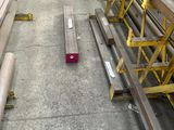 several pieces of wood are stacked on top of each other in a warehouse