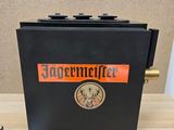 a black box with a clock on it on a table