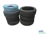 several tires stacked on top of each other on a white surface