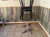 a table and chairs in the corner of a room
