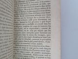 someone is holding a book open to a page with a picture on it