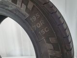 a close up of a tire on a white surface with a white background