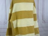yellow and white striped sweater on a mannequin stand