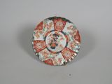 a plate with a design on it sitting on a table