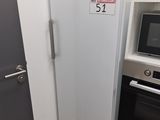 a refrigerator next to a microwave and oven in a room