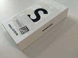 a white box on a table with a qr code on it