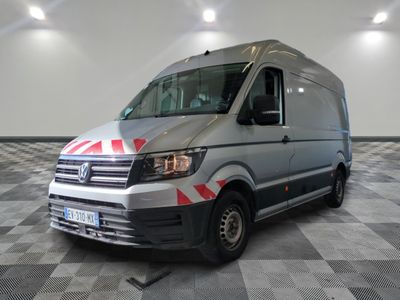 the van is parked on a checkered tile floor in the garage
