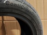 a close up of a tire on a cardboard box with a cardboard box in the background