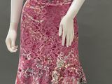 an image of a mannequin wearing a pink skirt with flowers on it