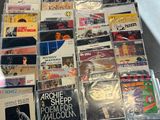 a lot of music cds on the table together