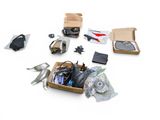 a box of assorted items sitting on a white surface