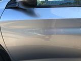a close up of a car ' s door handle and side mirror