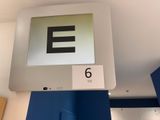 a sign that says e on the wall above the door