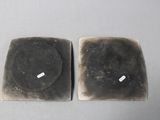two pieces of soap that have been placed on a table