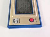 a small blue and silver electronic device on a white surface