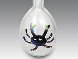 a glass vase with a picture of a crab inside of it