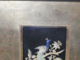 a picture of a picture of a peacock on a branch