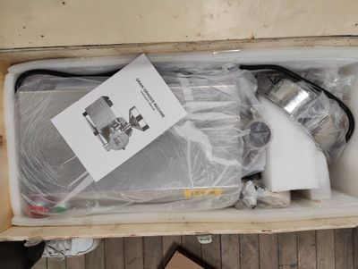 a box with some items in it on a wooden floor